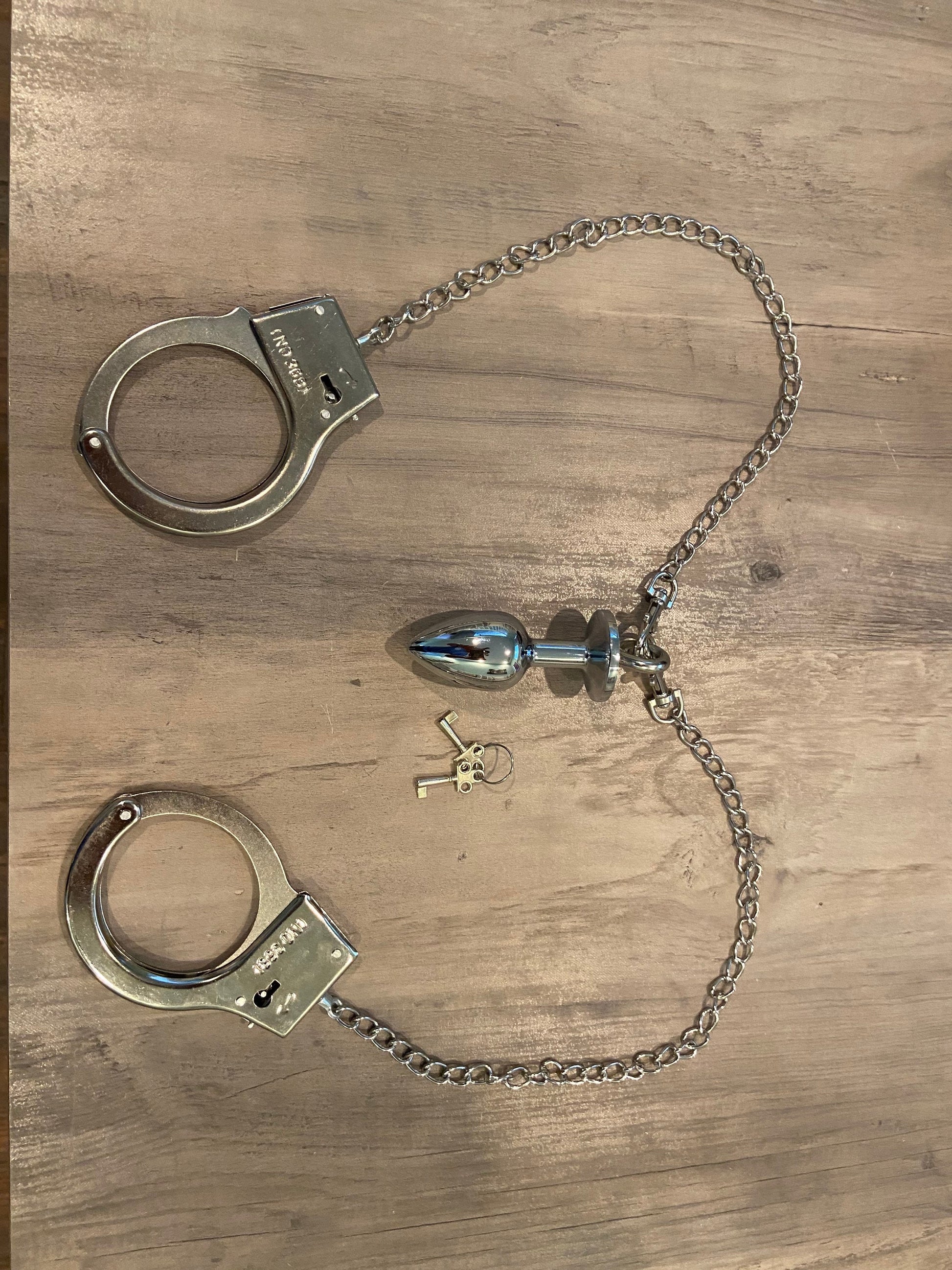Handcuff Butt Plug Combination Set Plug Emporium Handcuff Butt Plug Combination Set Plug Emporium